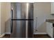 Stainless steel refrigerator in a kitchen with granite countertops and wood flooring at 3475 Glensford Dr, Decatur, GA 30032
