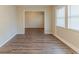 Living room with beautiful wood floors and plenty of natural light through a large window at 3475 Glensford Dr, Decatur, GA 30032