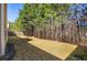 A view of the large backyard and trees around property at 1218 Lanier Springs Dr, Buford, GA 30518