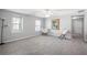 Inviting bedroom with windows, neutral carpet, and minimalist decor, creating a peaceful and airy sanctuary at 1218 Lanier Springs Dr, Buford, GA 30518