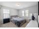 Bedroom with carpet, a plush bed, and a vanity with good natural light at 1218 Lanier Springs Dr, Buford, GA 30518