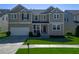 Charming two-story home featuring well-maintained lawn and attached two-car garage, offering curb appeal and convenience at 1218 Lanier Springs Dr, Buford, GA 30518
