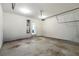 Open garage with water heater, ready for cars or hobbies with a step to enter the main house at 1218 Lanier Springs Dr, Buford, GA 30518