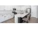 Modern kitchen featuring white cabinets, stainless steel appliances, and a large center island with seating at 1218 Lanier Springs Dr, Buford, GA 30518