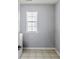 Light-filled laundry area with tile flooring and a large window at 1218 Lanier Springs Dr, Buford, GA 30518