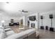 Open concept living area with a kitchen and fireplace at 1218 Lanier Springs Dr, Buford, GA 30518