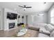 Cozy living room with fireplace, large windows and comfortable furniture at 1218 Lanier Springs Dr, Buford, GA 30518