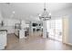 Bright open-concept living area connects to the kitchen, highlighted by luxury floors and a seamless indoor-outdoor flow at 1218 Lanier Springs Dr, Buford, GA 30518