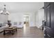 Bright and airy living room featuring modern decor, stylish furniture, and elegant flooring, perfect for relaxing or entertaining at 1218 Lanier Springs Dr, Buford, GA 30518