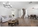 Spacious living area merging with the dining area, filled with natural light and stylish furnishings, enhancing the home's appeal at 1218 Lanier Springs Dr, Buford, GA 30518