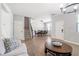 Open-concept living space blending modern living room with a dining area, and staircase, ideal for Gathering gatherings at 1218 Lanier Springs Dr, Buford, GA 30518