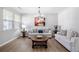 Stylish living room with modern light fixtures, soft couches, and refined decor, creating a comfortable and attractive space at 1218 Lanier Springs Dr, Buford, GA 30518