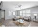 Inviting living room with a comfortable sofa, ample natural light, and stylish decor at 1218 Lanier Springs Dr, Buford, GA 30518