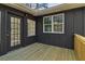 Back porch of home featuring a new deck at 460 Stockwood Dr, Woodstock, GA 30188
