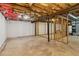 Unfinished basement with concrete floor, exposed ceiling and wooden framing at 460 Stockwood Dr, Woodstock, GA 30188