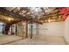 Unfinished basement with concrete floors, exposed ceiling, and utilities at 460 Stockwood Dr, Woodstock, GA 30188