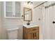 Bathroom with modern wood vanity, updated lighting, and shower/tub at 460 Stockwood Dr, Woodstock, GA 30188