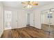 Bedroom featuring wood floors, neutral paint, and a mirrored closet at 460 Stockwood Dr, Woodstock, GA 30188