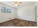 Comfortable bedroom with ceiling fan, and view to the outdoors through a bright window at 460 Stockwood Dr, Woodstock, GA 30188