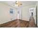 Bedroom featuring wood floors, neutral paint, and a ceiling fan at 460 Stockwood Dr, Woodstock, GA 30188