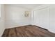 Bedroom featuring wood floors, neutral paint, and a large closet at 460 Stockwood Dr, Woodstock, GA 30188