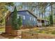 Charming exterior of a single-story home with brick accents and well-maintained landscaping at 460 Stockwood Dr, Woodstock, GA 30188