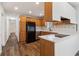 Bright kitchen with wood cabinets, stainless steel appliances, and modern countertops at 460 Stockwood Dr, Woodstock, GA 30188