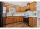 Well-equipped kitchen featuring stainless steel appliances, wood cabinets and bright countertops at 460 Stockwood Dr, Woodstock, GA 30188