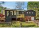 This home features a backyard, brick accents, an attached garage, and a new back deck at 460 Stockwood Dr, Woodstock, GA 30188