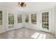 Sunroom has three large windows and two glass doors that lead to the outside at 460 Stockwood Dr, Woodstock, GA 30188