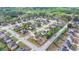 An aerial view captures the expansive suburban neighborhood, highlighting mature trees and well-kept lawns at 9 Oatgrass Dr, Grayson, GA 30017