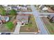 Aerial view of a home with a manicured lawn and mature trees in a neighborhood at 9 Oatgrass Dr, Grayson, GA 30017