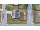 Aerial view of a home with a large manicured front lawn and mature trees in a neighborhood at 9 Oatgrass Dr, Grayson, GA 30017