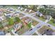 An aerial view highlights a house with a manicured lawn nestled in a mature tree lined neighborhood at 9 Oatgrass Dr, Grayson, GA 30017