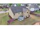 Aerial view of a backyard with a patio seating area and privacy fence at 9 Oatgrass Dr, Grayson, GA 30017