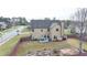 Aerial view of the backyard with a patio and privacy fence at 9 Oatgrass Dr, Grayson, GA 30017