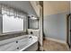 Bathroom with a soaking tub, gray tiled walls, and a shower at 9 Oatgrass Dr, Grayson, GA 30017