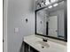 Well-lit bathroom showcasing a vanity with a decorative mirror and fixtures, creating a fresh, inviting space at 9 Oatgrass Dr, Grayson, GA 30017