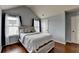 Cozy bedroom with hardwood floors, windows, and neutral color palette at 9 Oatgrass Dr, Grayson, GA 30017