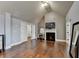 Bedroom with hardwood flooring, fireplace, vaulted ceilings, and three doors at 9 Oatgrass Dr, Grayson, GA 30017