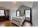 Cozy bedroom with hardwood floors, natural light, and a classic dresser for comfortable living at 9 Oatgrass Dr, Grayson, GA 30017