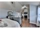 Bedroom with a fireplace, hardwood flooring, vaulted ceiling and a ceiling fan at 9 Oatgrass Dr, Grayson, GA 30017