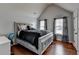 Comfortable bedroom features a plush bed with decorative pillows and bright windows with stylish curtains at 9 Oatgrass Dr, Grayson, GA 30017