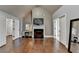 Bedroom features hardwood flooring, a fireplace, vaulted ceiling and many doors at 9 Oatgrass Dr, Grayson, GA 30017