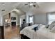 Bedroom with hardwood flooring, ceiling fan, and fireplace at 9 Oatgrass Dr, Grayson, GA 30017