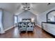 Bedroom features hardwood flooring, a ceiling fan and sitting area at 9 Oatgrass Dr, Grayson, GA 30017