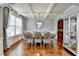 Elegant dining room with tray ceilings, hardwood floors, and stylish chandelier lighting at 9 Oatgrass Dr, Grayson, GA 30017