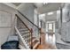 Bright foyer with wood floors and a staircase leading to the second level at 9 Oatgrass Dr, Grayson, GA 30017