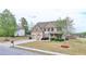 Lovely two-story home featuring a well-manicured lawn, two car garage, and a basketball hoop at 9 Oatgrass Dr, Grayson, GA 30017