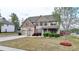 Beautiful two-story home with a well-manicured lawn and a basketball hoop in the driveway at 9 Oatgrass Dr, Grayson, GA 30017